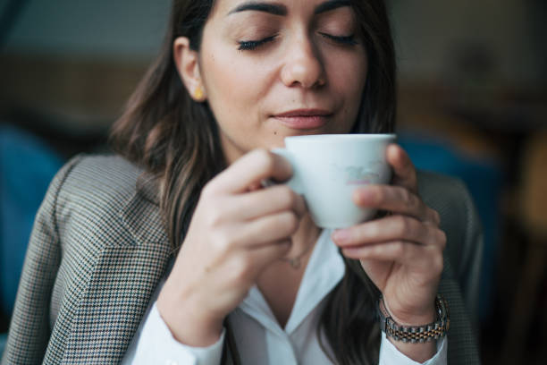 istock A woman enjoys a cappuccino in a cafe 1944072809