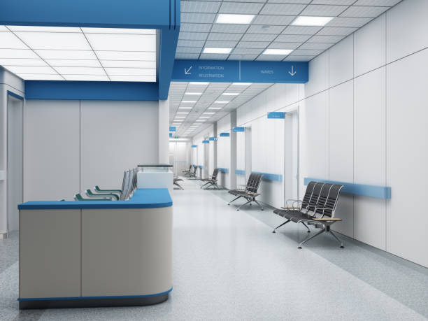 istock Empty Hospital Corridor With Reception Desk, Seats And Closed Doors 1944101534