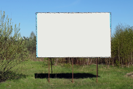 Empty billboardsin the green  spring forest