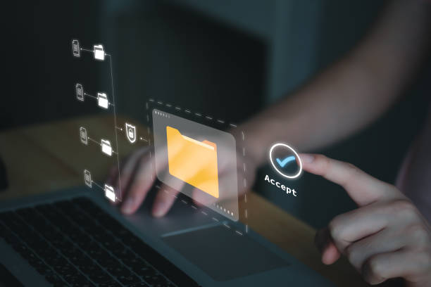 istock Businessman using computer laptop and touch on virtual correct check mark for verify and access to online document files folder on system. Database and Document Management System, DMS concept. 1944290259