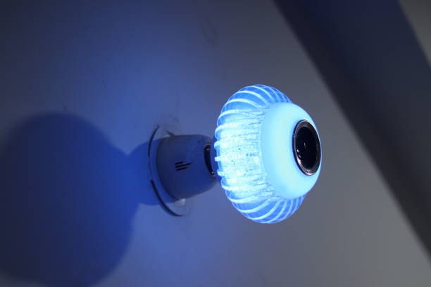istock Color changing spiral decorative LED wireless Speaker Bulb light illuminated in light blue color light, bulb holder 1944297532