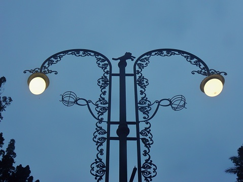 Street lights on street walls of city buildings