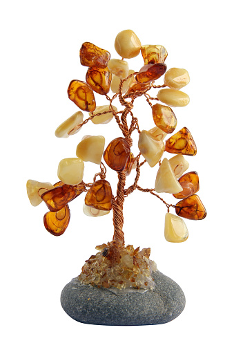 Homemade tree made from glue wire and amber . Isolated on white
