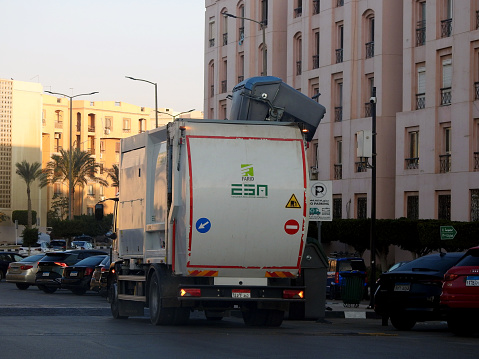 Cairo, Egypt, January 6 2024: A garbage truck, rubbish truck, a truck specially designed to collect municipal solid waste and transport it to a solid waste treatment facility, such as a landfill, selective focus