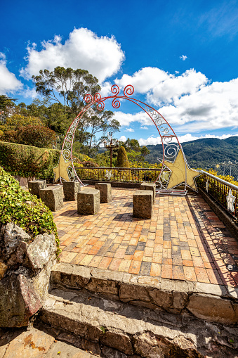 Monserrate (named after Catalan homonym mountain Montserrat), high mountain over 10,000 feet high that dominates the city center of Bogota, the capital city of Colombia.