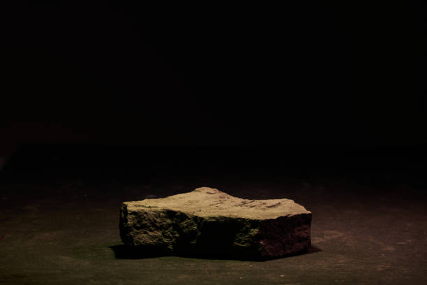 istock Flat stone pedestal in yellow neon light template banner background. Minimalism concept, empty podium display product, presentation scene 1944457087