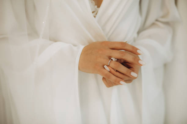 istock Young bride wearing beautiful engagement ring, closeup 1944471787