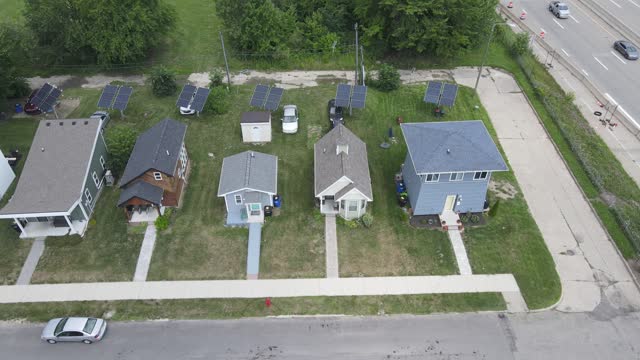Aerial sideways shot from the Tiny home project, Cass community for people in need, next to a highway, Detroit, Michigan