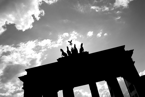 Brandenburger Tor (Brandenburg Gate) silhouetted on a beautiful sunny day in Berlin, Germany.