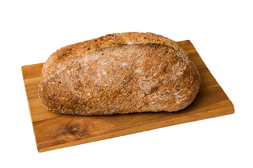 Freshly baked bread on cutting board isolated on white background . perspective view bread with copy space.