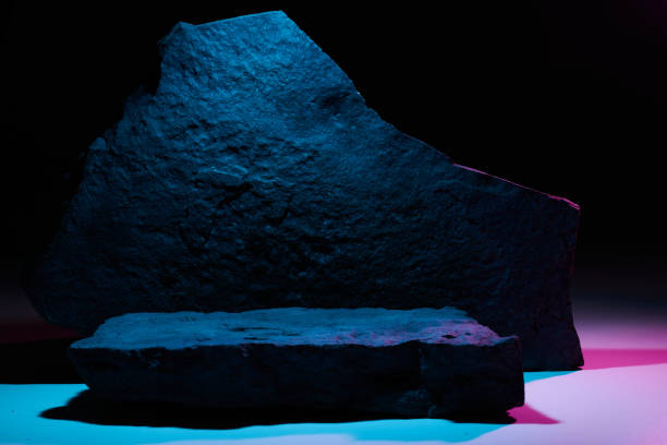 istock Flat stone pedestal in pink blue neon light template banner background. Minimalism concept, empty podium display product, presentation scene 1944494687