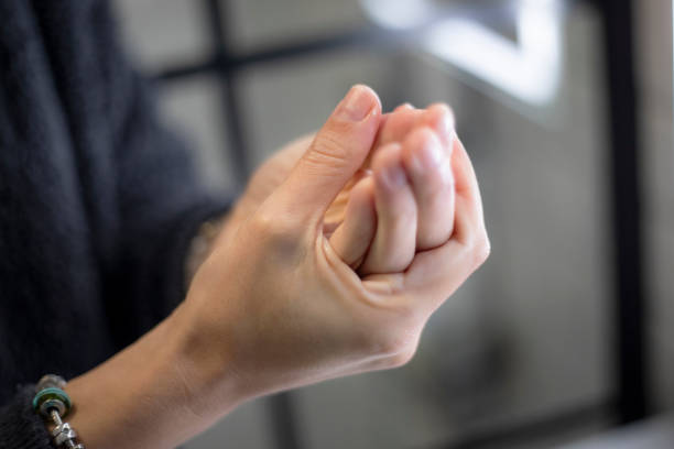 Woman applying cream to her hands