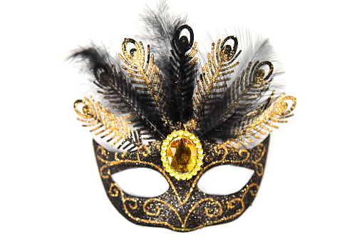 Masquerade mask with sparkles, jewel and feathers on a white background. Incognito, hidden face.Masquerade mask, sparkles, jewel , feathers, Incognito, hidden face