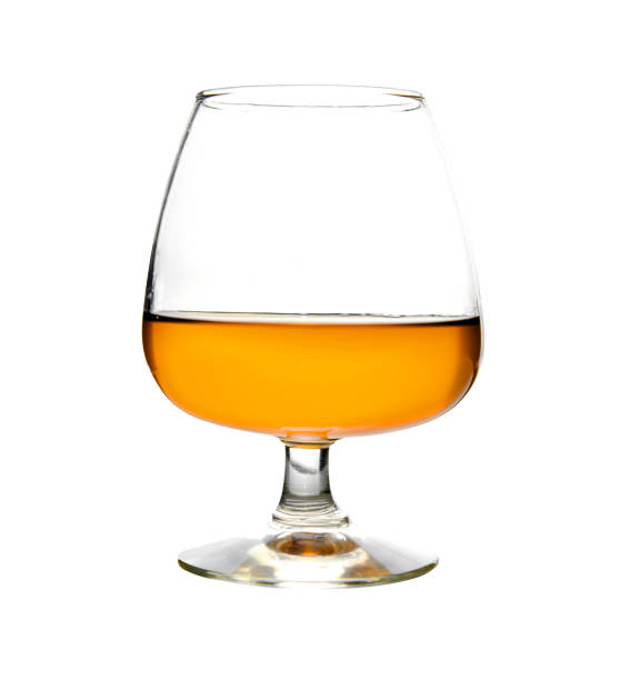 Glass of cognac on a white background Glass of cognac isolated on a white background. Alcoholic drink cognac. Bar. Drinks menu. crystal chalice stock pictures, royalty-free photos & images