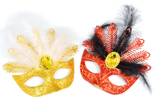 Two masquarade carnival shiny masks with feathers. Costume on face