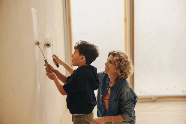 istock Family creativity: Mother and son bonding through home renovation 1944556408