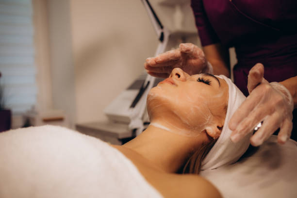 istock a cosmetologist performs a silky face procedure on a woman 1944590262