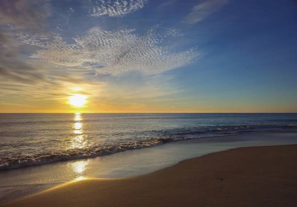 sunrise at sea with sky of varied colors