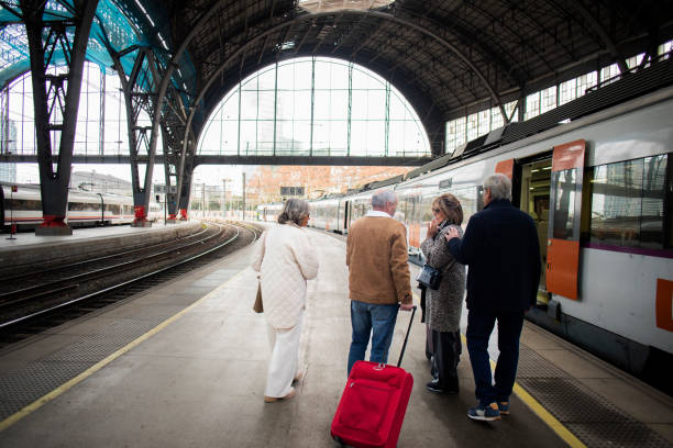 istock Senior friend at the train station 1944608320