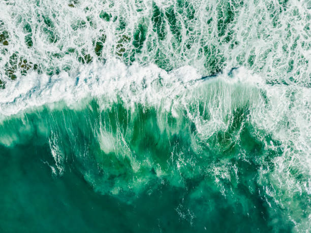 istock Large waves of turquoise rough sea from above 1944609913