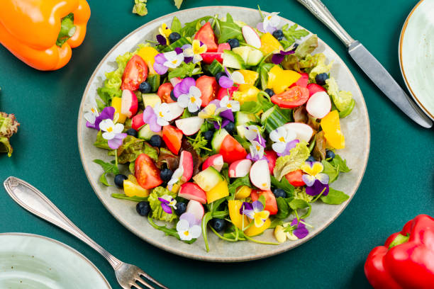 istock Vegetable salad decorated with flowers. 1944613602