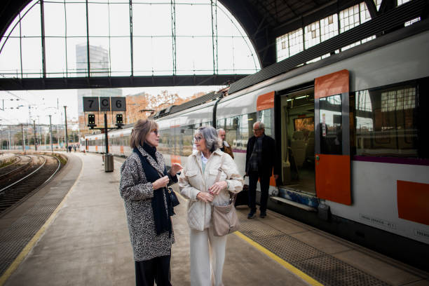istock Senior friend at the train station 1944614152