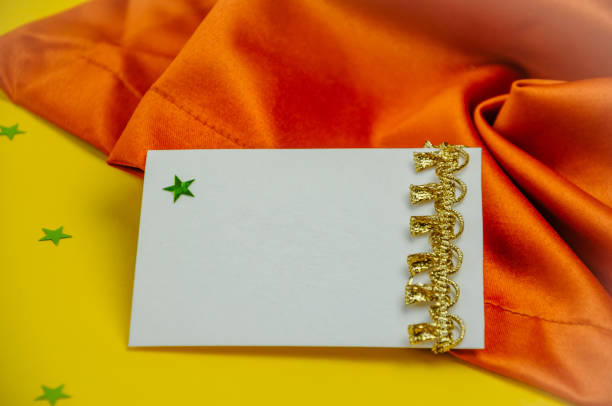 Yellow and brown background with a sheet for writing greetings. High quality photo