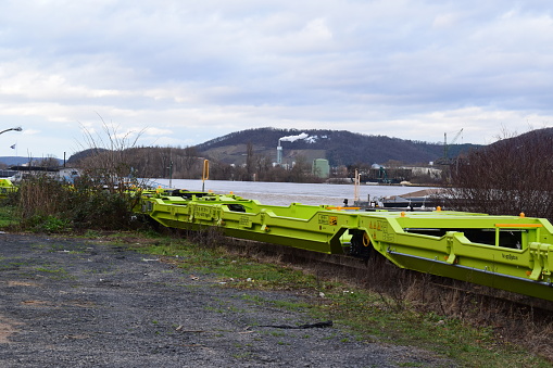 Brohl, Germany - 01/05/2024: bright yellow railroad wagons at the flood