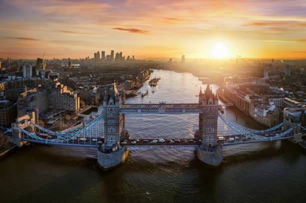 Aerial sunrise view of the famous Tower Bridge in London Aerial view of the famous Tower Bridge in London, England, during a colorful winter sunrise behind london docklands stock pictures, royalty-free photos & images