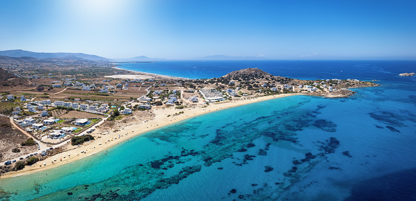Panoramic aerial view of the beach at Mikri Vigla with fine sand and turquoise shining sea, Naxos island, Greece