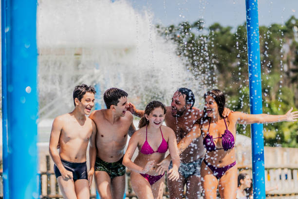 istock Family having fun at water park 1944640604