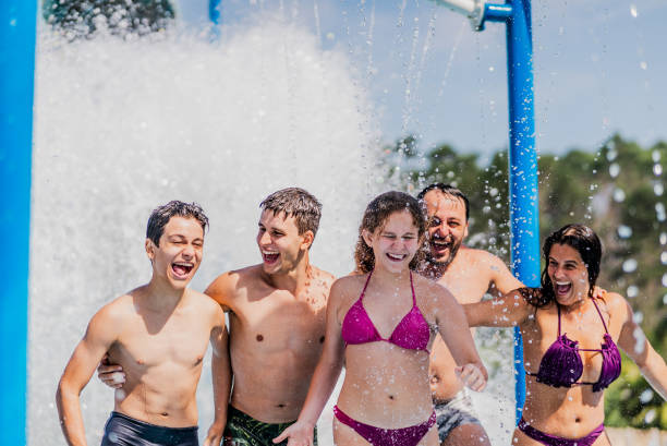 istock Family having fun at water park 1944640608