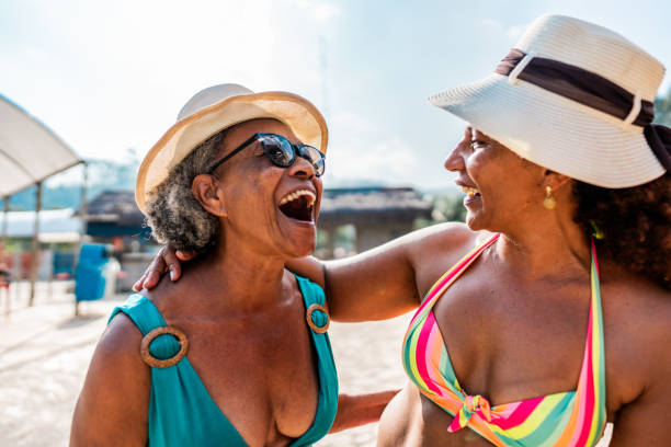 istock Mother and daughter talking at water park 1944665873