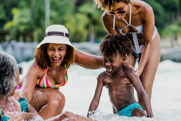 istock Family playing at water park pool 1944677022
