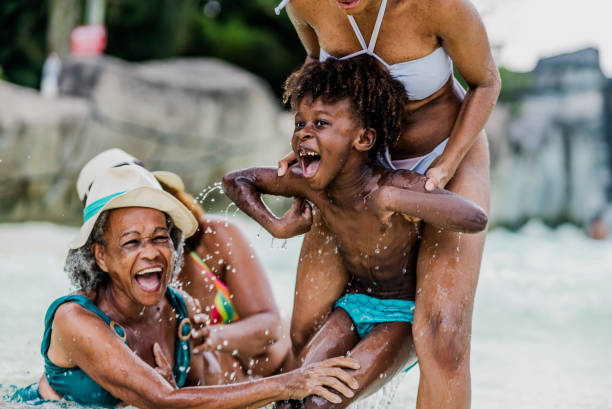 istock Family playing at water park pool 1944677038