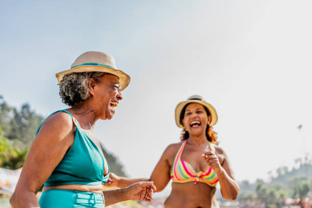 istock Mother and daughter talking at water park 1944678100