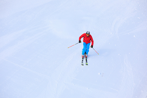 Winter sport.  Vital senior men, Happy snow skier, enjoying on  perfect ski slope, fresh prepared  piste,  ski resorts.  Snowcapped mountain  Dolomite super ski area. Ski resort. Sellaronda, italy, Europe
