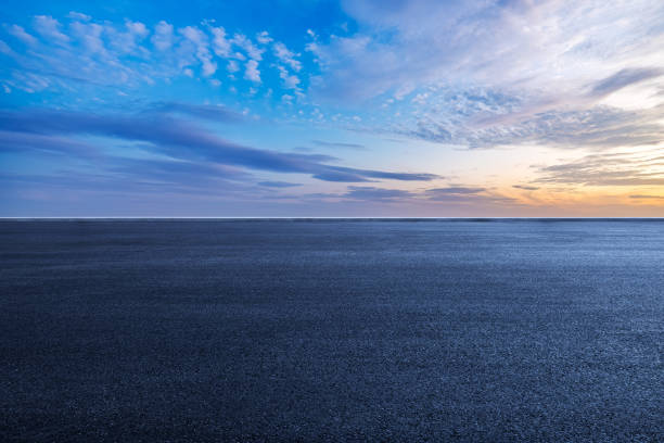 New asphalt road and sky clouds background