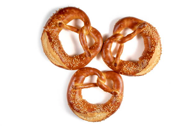 istock Three Bavarian Pretzel with Sesame on White Background 1944731794