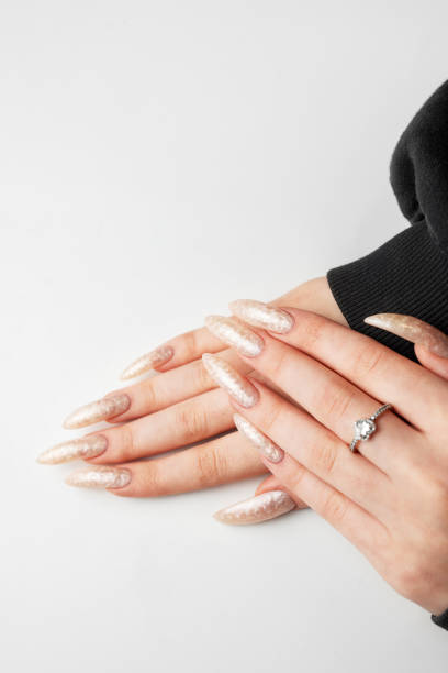 istock Manicured nails with pearlescent nail polish 1944739672