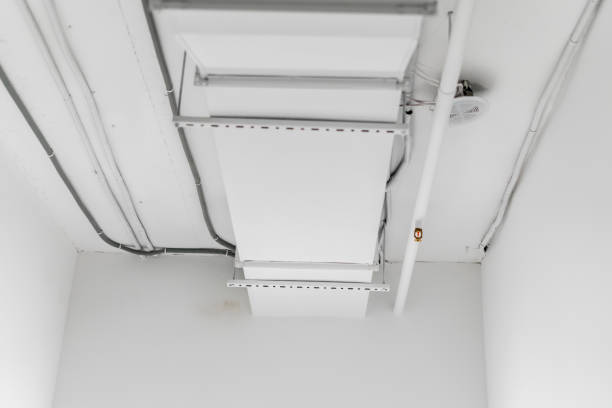 istock This image shows a large industrial air ventilation unit mounted on a white wall, with venting slats directing airflow within a contemporary building. 1944756824