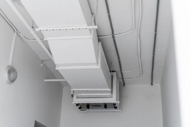 istock This image shows a large industrial air ventilation unit mounted on a white wall, with venting slats directing airflow within a contemporary building. 1944757353