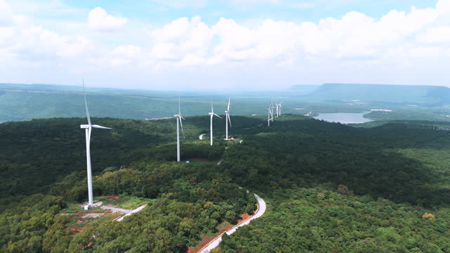 Aerial shot city of wind turbine renewable energy plants at Nakhonratchasima , Green power electricity generation.