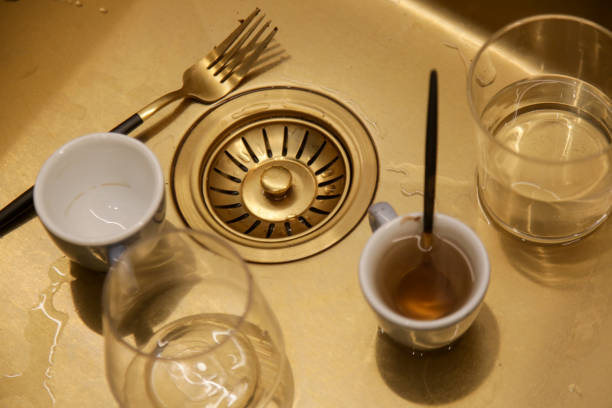 istock Dirty dishes in kitchen sink 1944775466