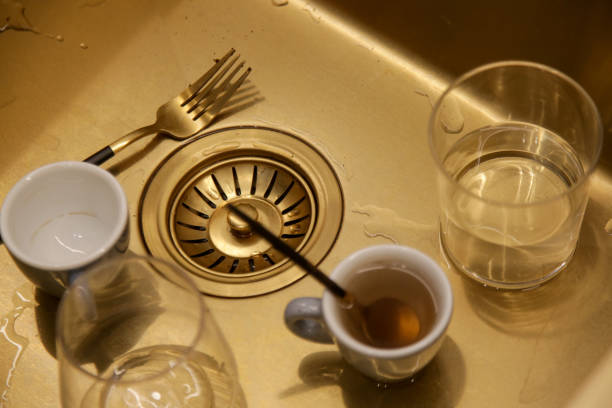 istock Dirty dishes in kitchen sink 1944775469
