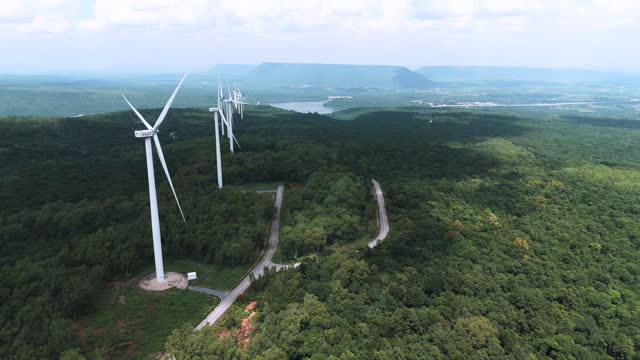 Aerial shot city of wind turbine renewable energy plants at Nakhonratchasima , Green power electricity generation.