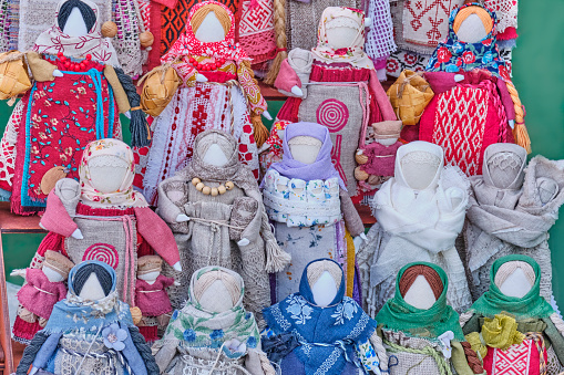 Little slavic folk rag dolls - mascots associated with heathen traditions. In middle row dolls of Motherhood or Mother in Childbirth, amulets for happy motherhood. Handmade souvenirs or gifts on fair