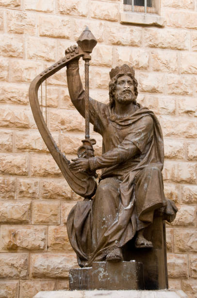 bronze statue of king david playing the harp outside his tomb in the old city of jerusalem, israel. - king of the jews ストックフォトと画像