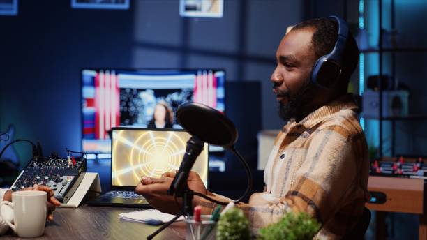 istock Online show host speaking with guest during live broadcast for social media platforms 1944795235
