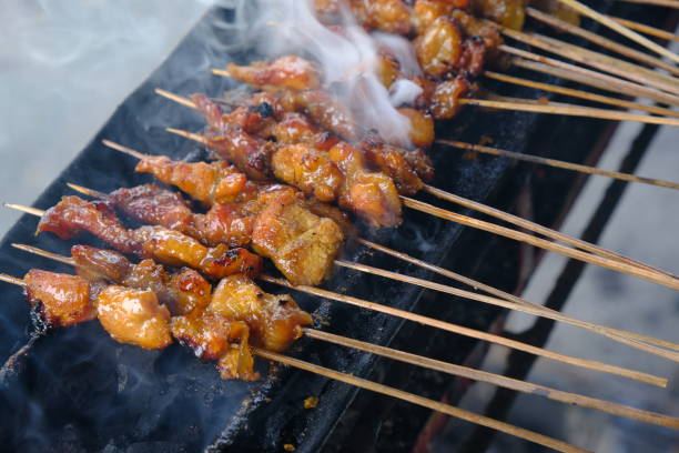 istock Sate Ambal is a chicken satay typical of the Kebumen area of Central Java. This satay is made from chicken meat seasoned with spices. Sate is cooked by grilling on a charcoal grill. Indonesian food. 1944799023